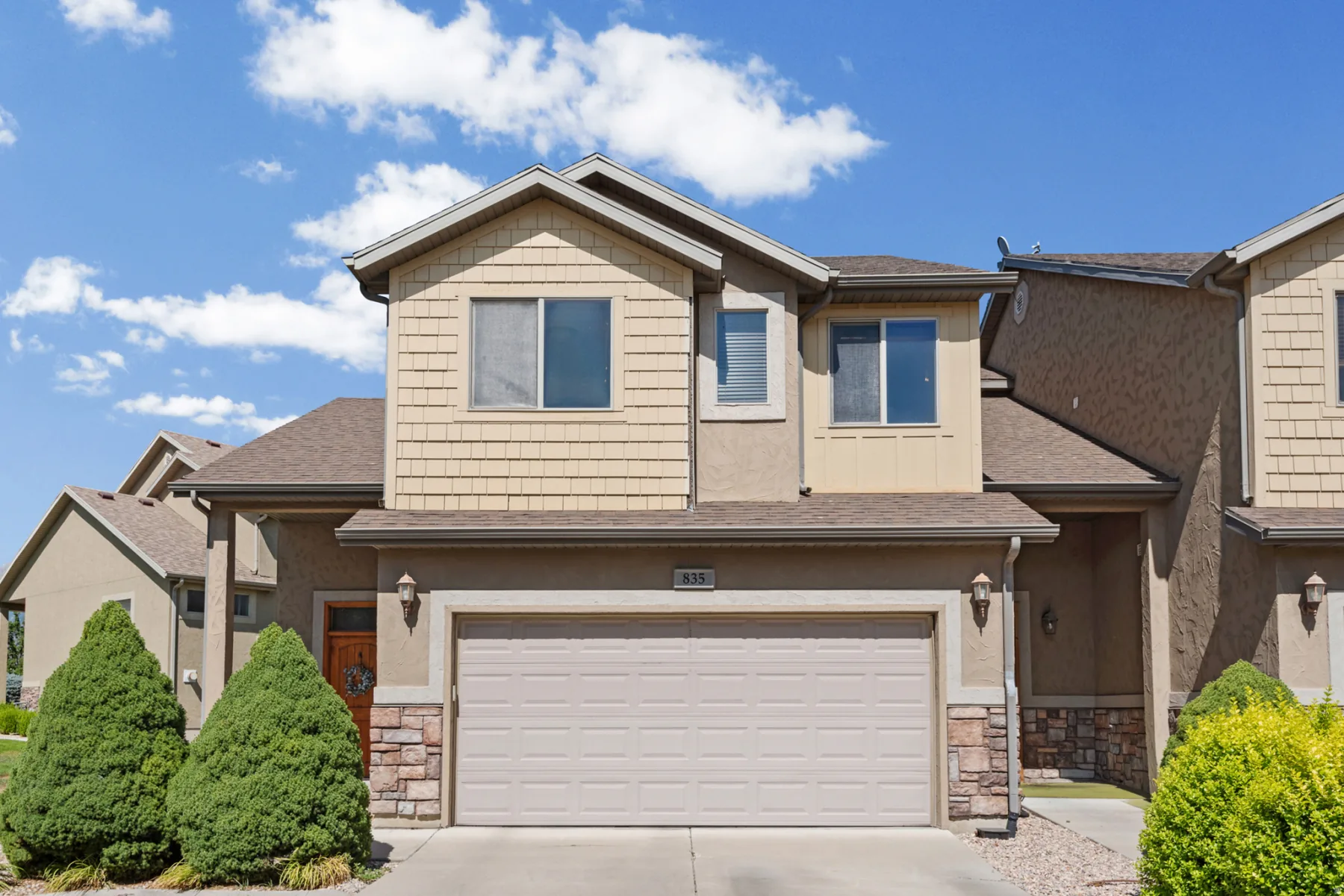 Front of the townhome and its two-car garage